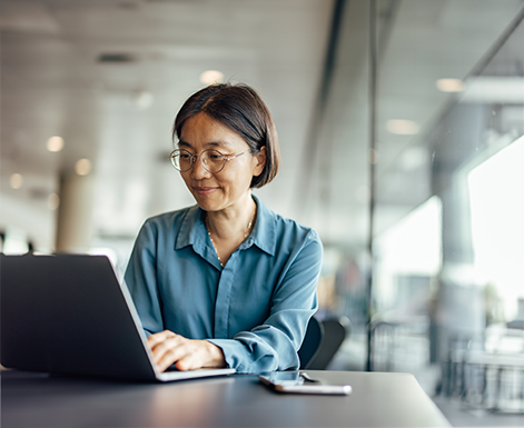 HR professional, woman, working on laptop